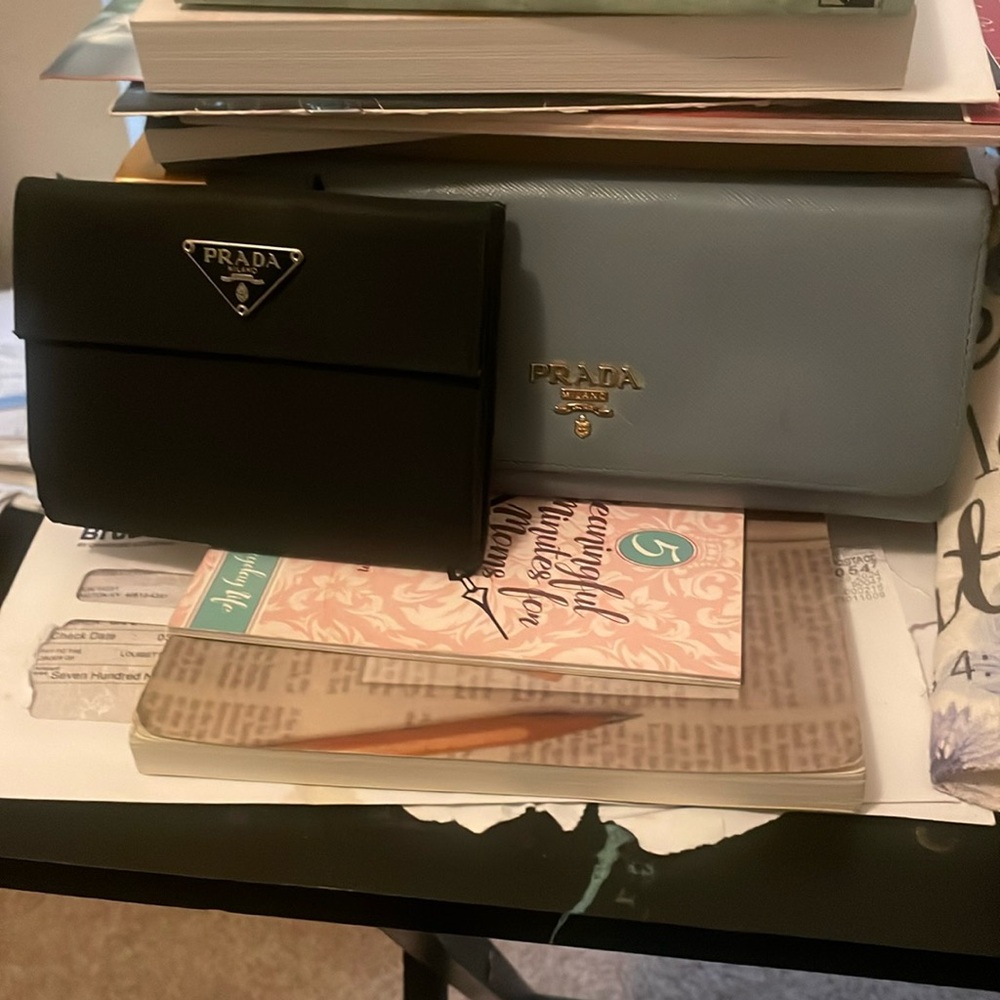 2 authentic luxury Prada wallets